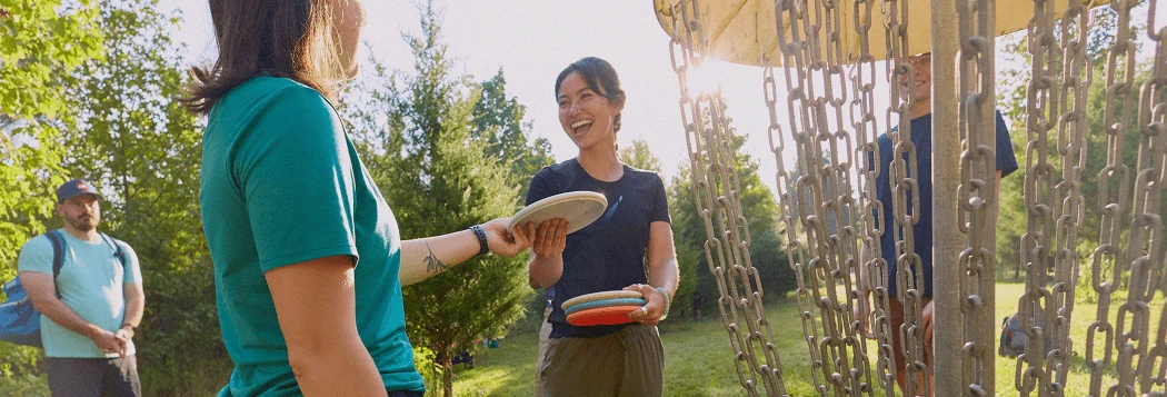 Handing a disc to a friend